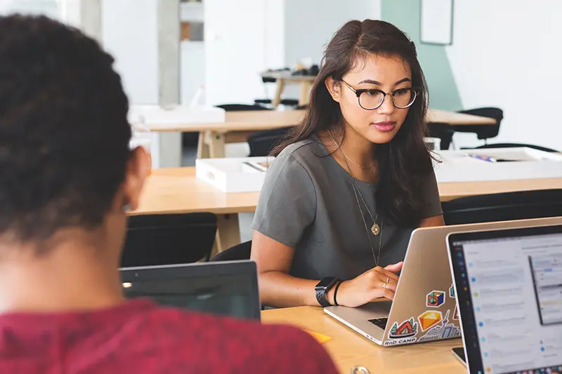 staff-with-blue-cut-lenses-at-table-working