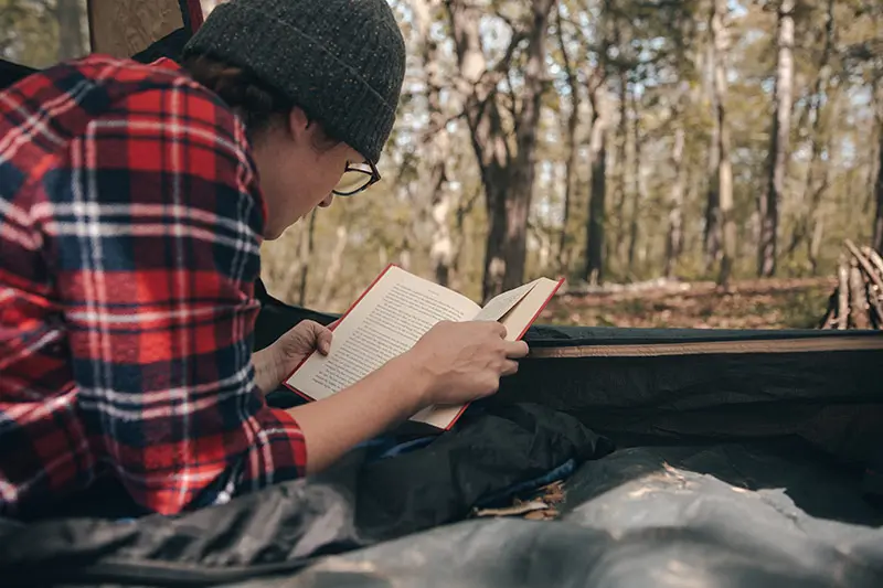 woman-reading-in-tent